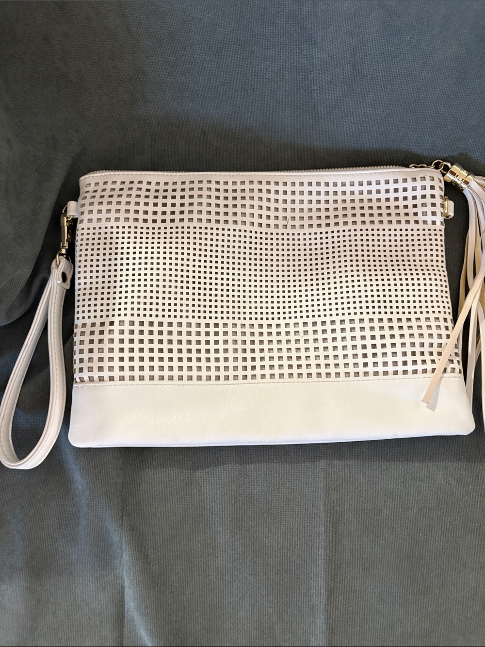 Perforated White Wristlet Clutch with Tassel Accent